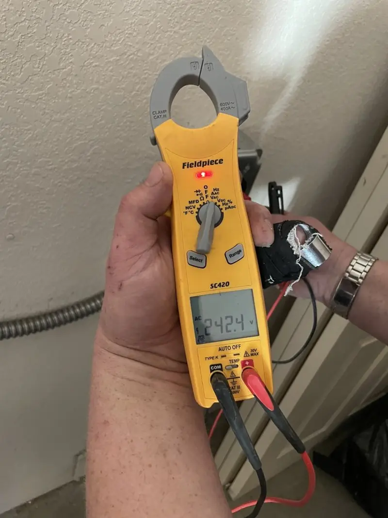 Voltage testing with clamp meter during Outlet Installation in Watsonville